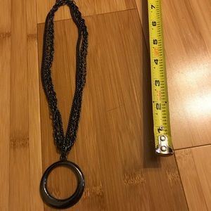 Black necklace with medallion